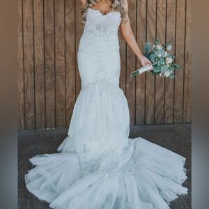 Neta BenShabu Paris gown. French lace Wedding Dress with see through bodice